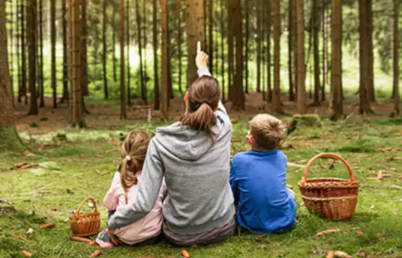 Mother and children together in nature, calm and connected